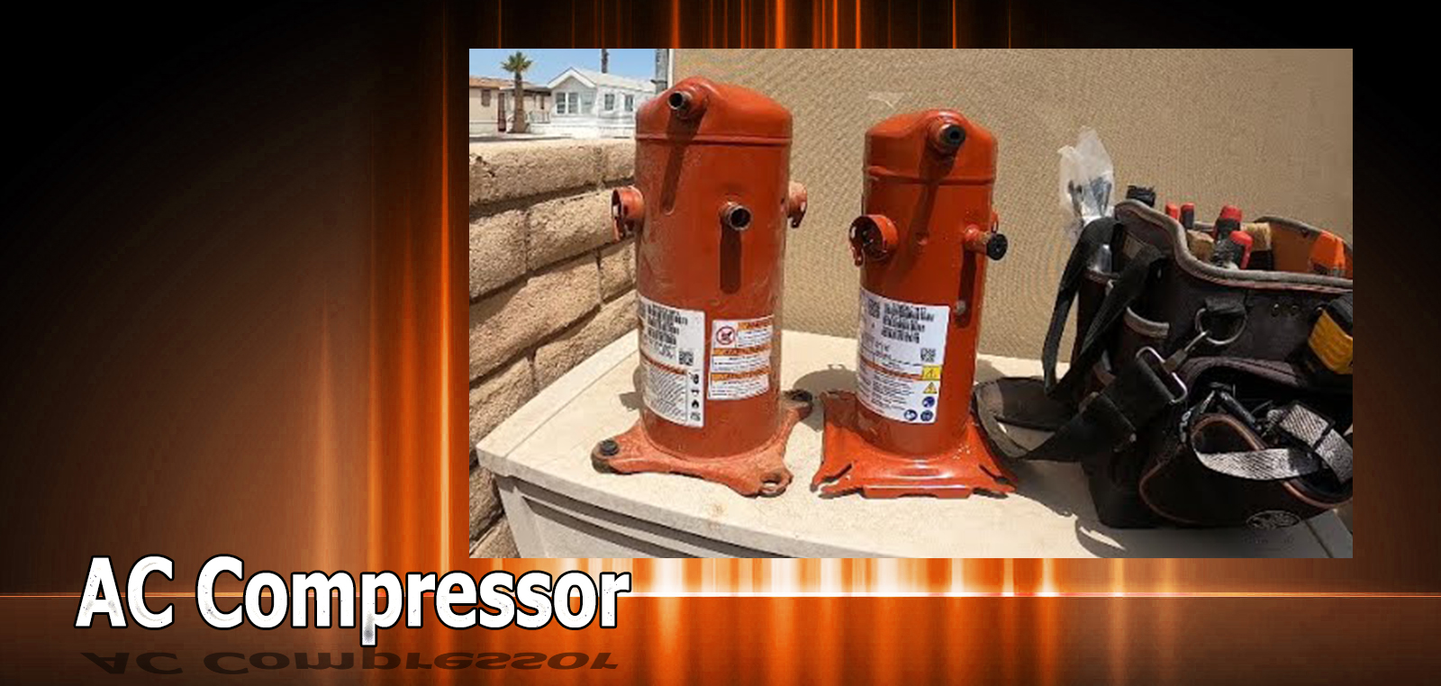 Twin AC compressors with tools on concrete.