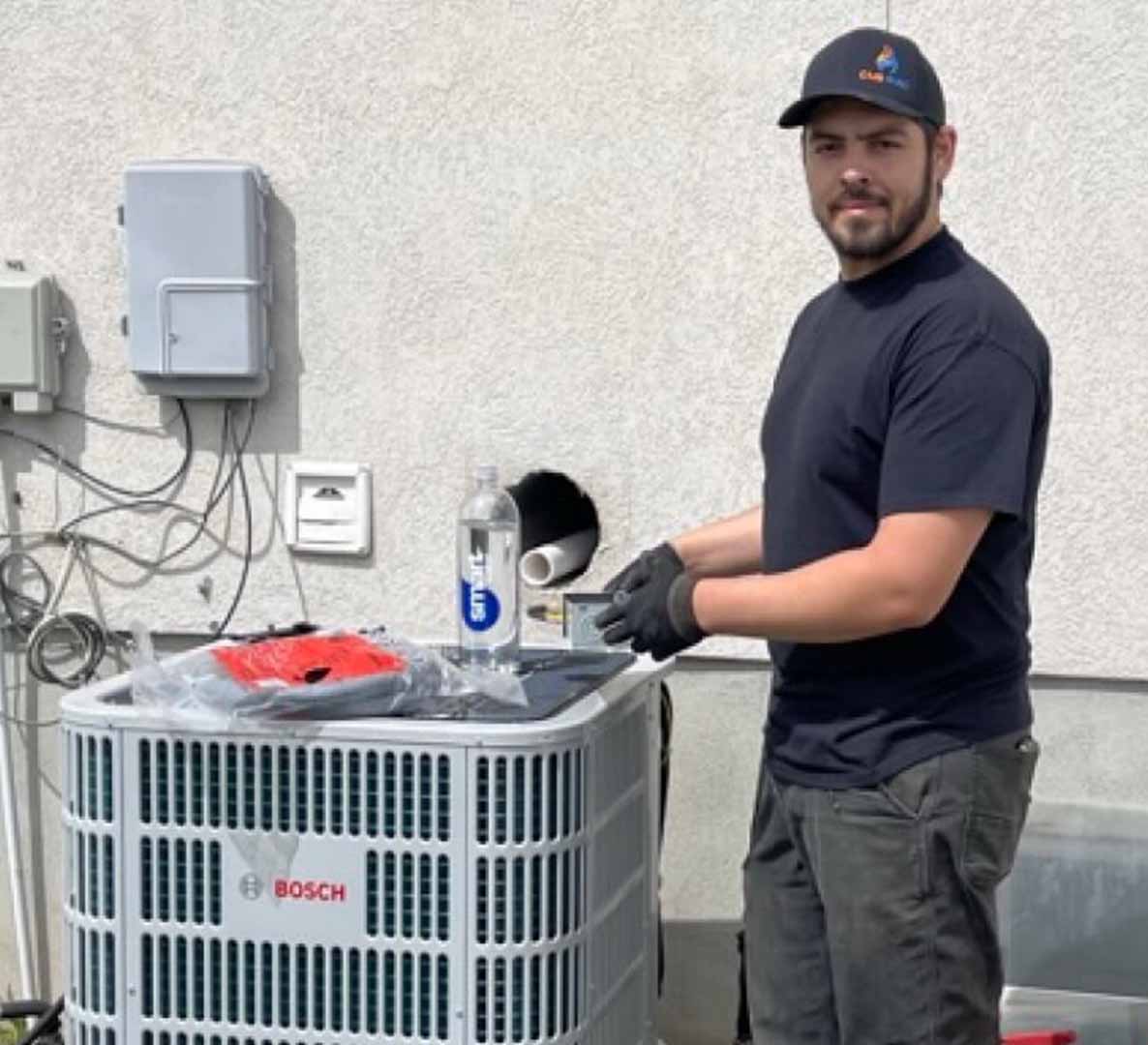 Technician servicing an outdoor AC unit