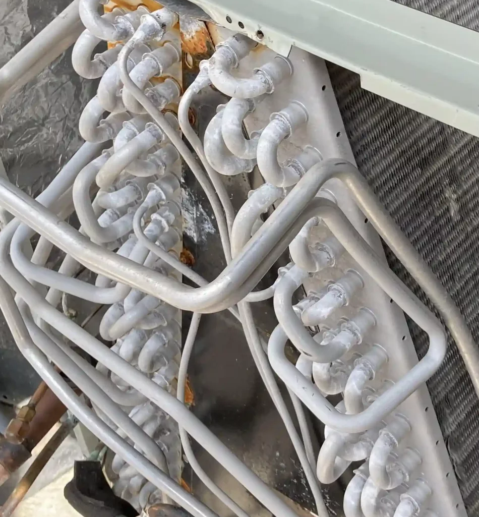 Frozen air conditioner pipes in cold weather.